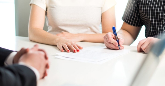 Couple signing agreement or contract