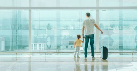 Father with his son at the airport