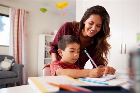 mother helping son with homework