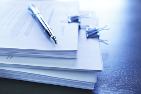 legal documents and a pen