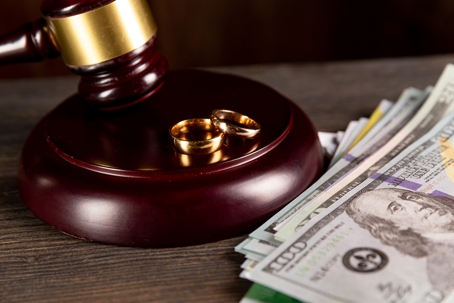 gavel, wedding rings, and money